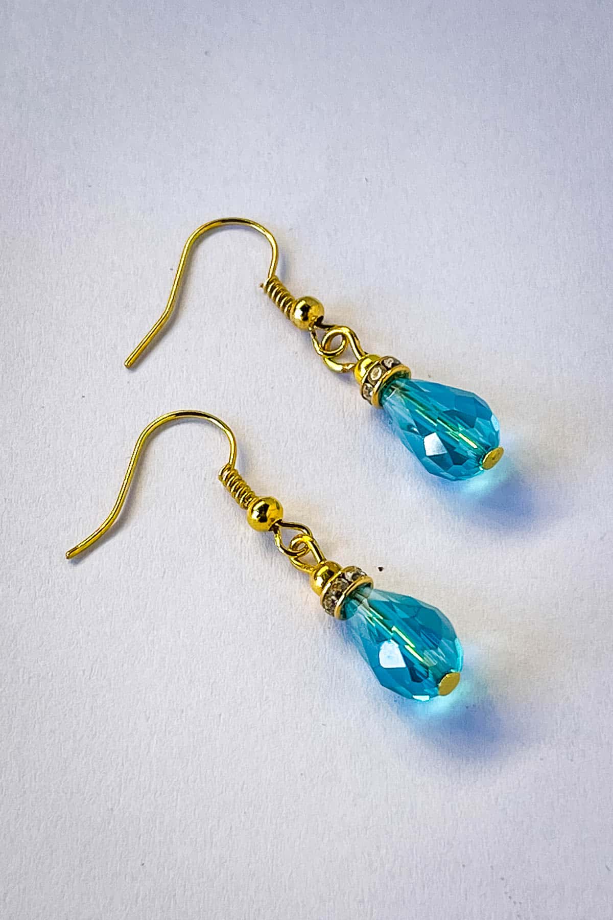 A pair of beaded teardrop earrings.