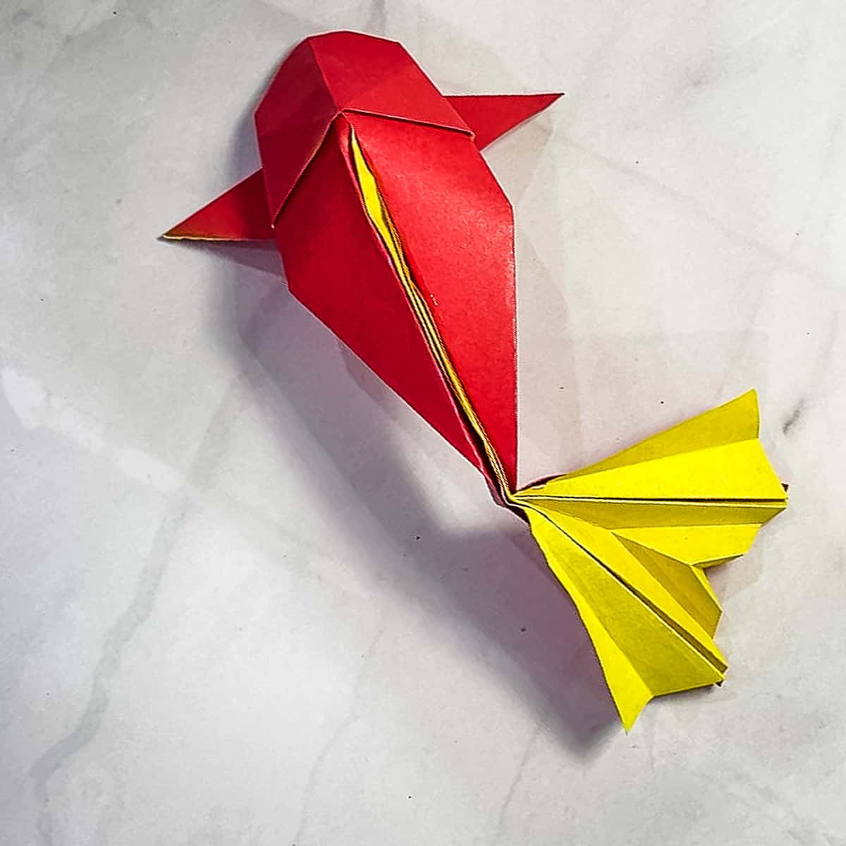 A red and yellow origami koi fish.
