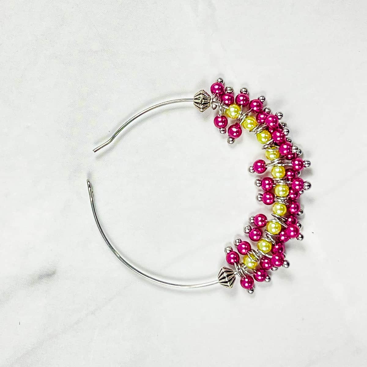 Beads in a hoop for seed bead earrings.