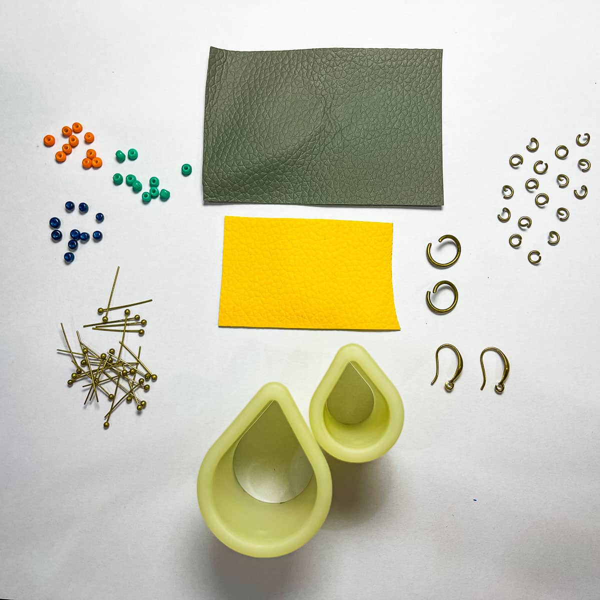 Supplies to make faux leather earrings.