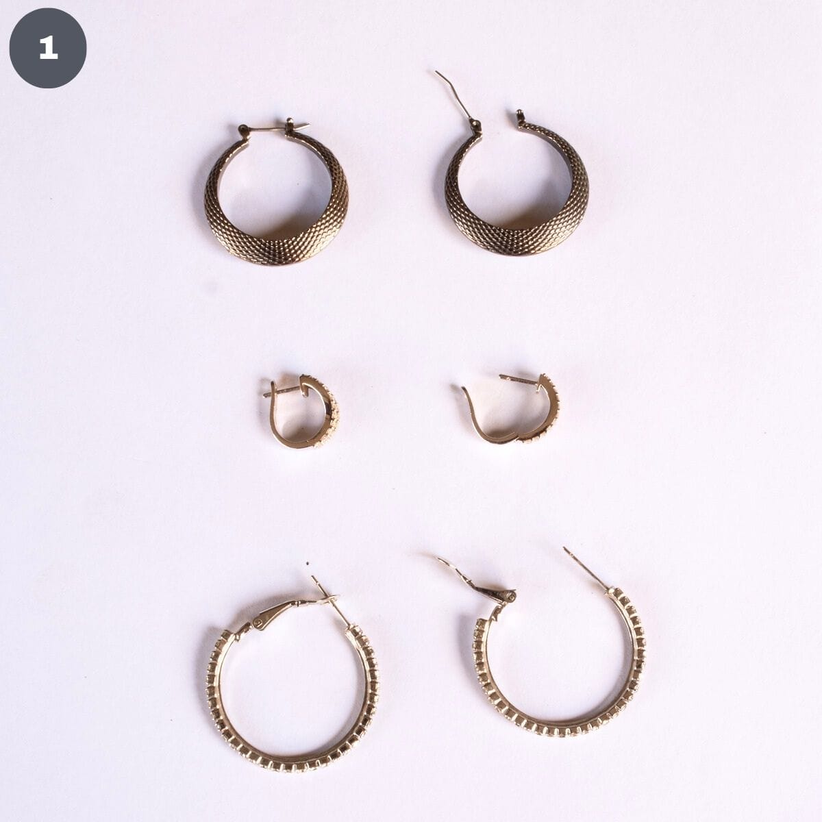 3 pairs of hoop earrings.