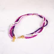 Seed bead necklace in purple and gold.