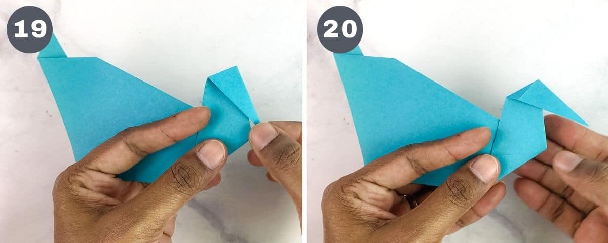 Folding the head and neck of a paper duck.
