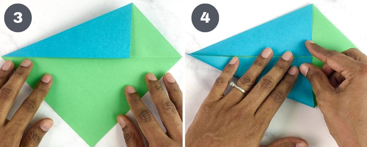 Folding a blue and green paper.