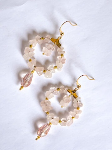 A pair of pink quartz beaded hoop earrings.