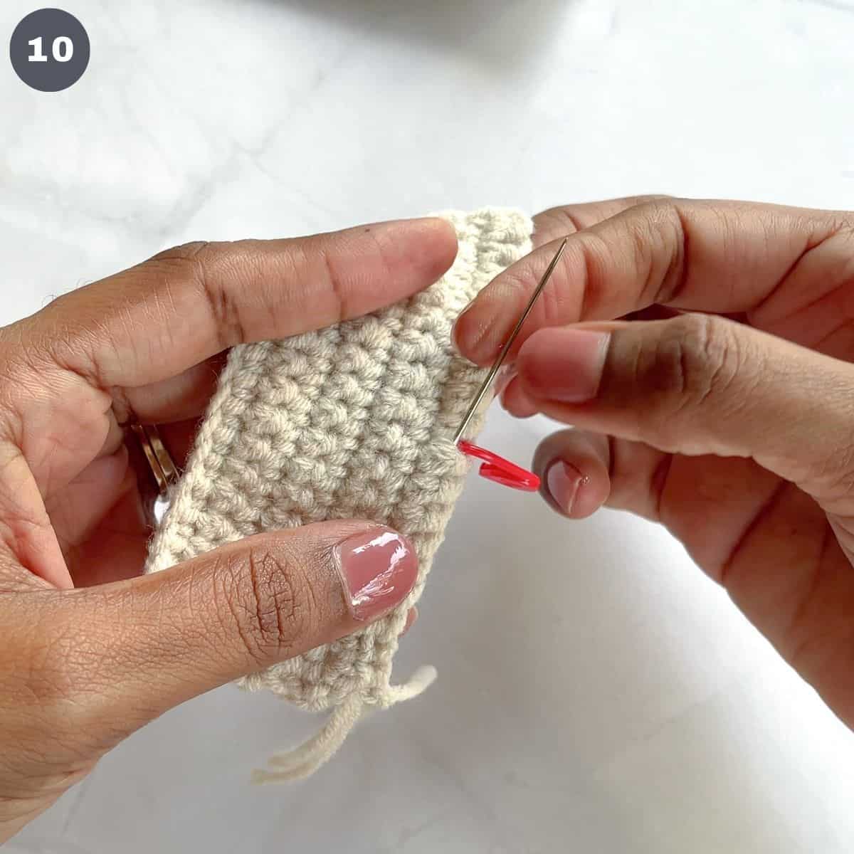 Threading yarn to the center of a crocheted rectangle.