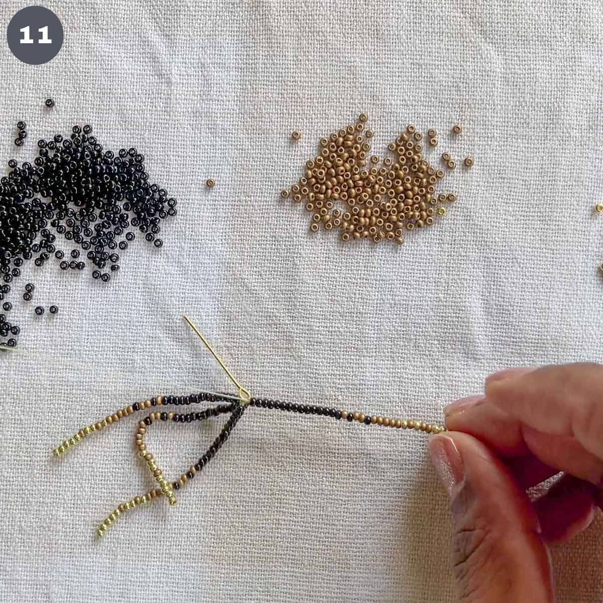 4 strands of beads attached to an eye pin.