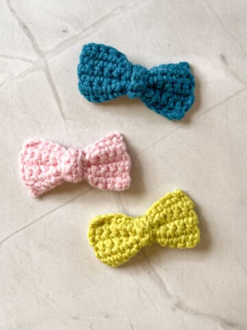 Blue, pink and green crochet bows.