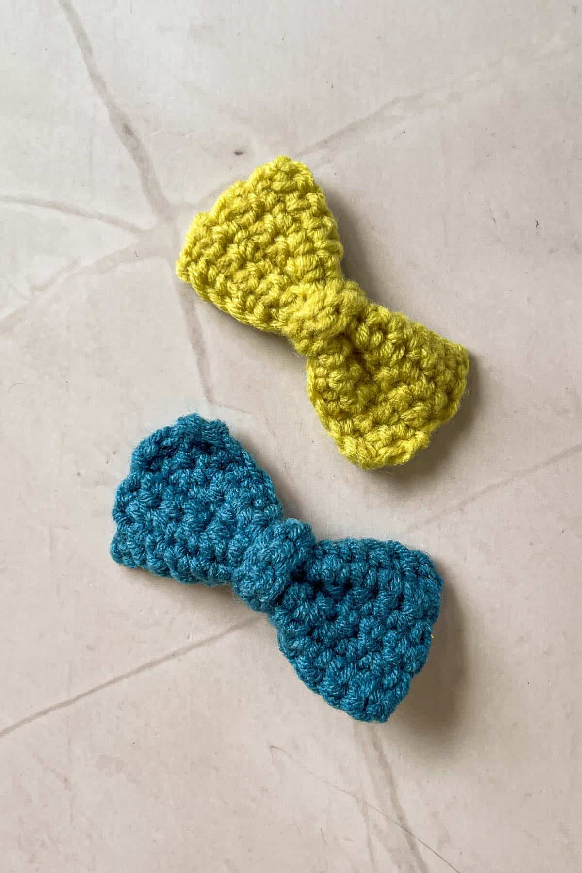 Blue and green crochet bows.