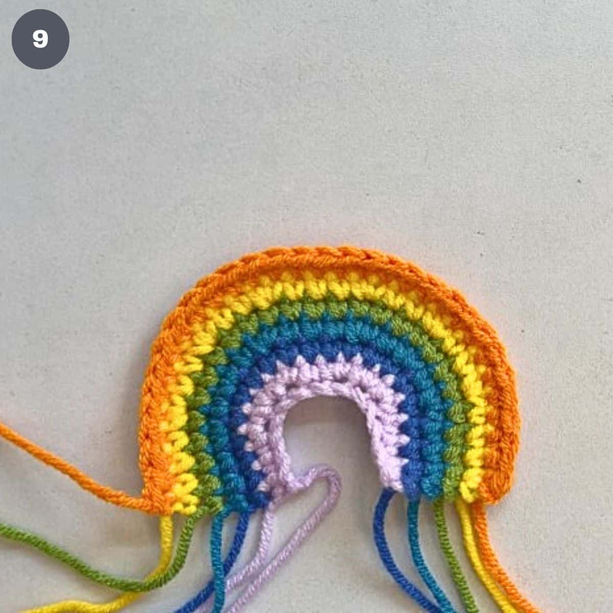 A crochet rainbow made using 6 colors of yarn.