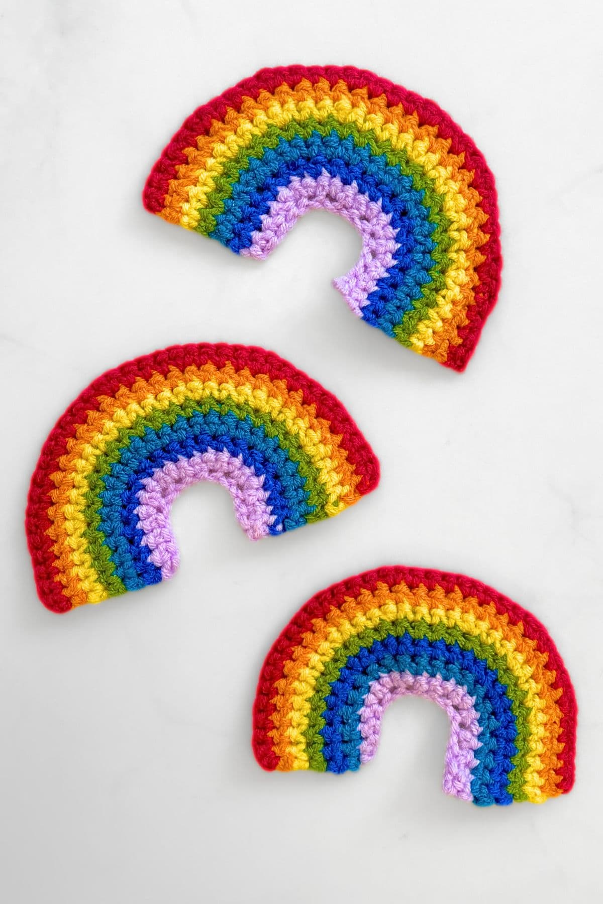 Three crochet rainbows.