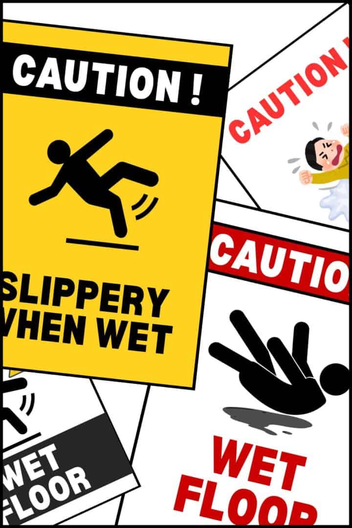 Wet floor signs overlapping on one another.